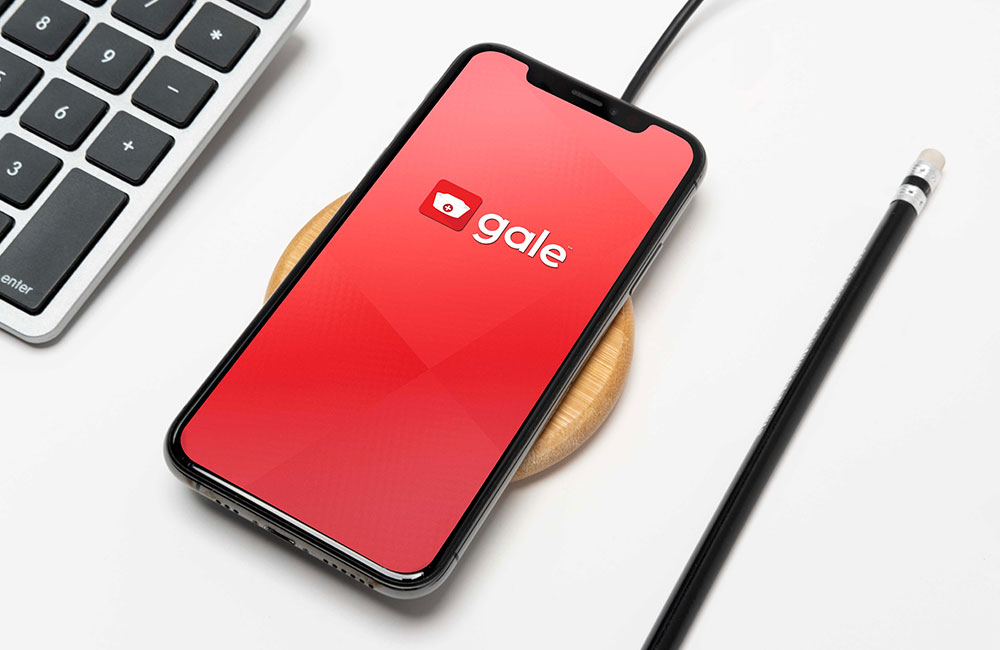 mobile phone with gale app logo on the screen